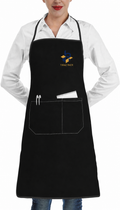 Front view of a black chef apron embroidered with the Tiraz Pack logo
