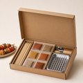 Unbranded corrugated cardboard barbecue picnic kit box with spices, skewers and grilling accessories