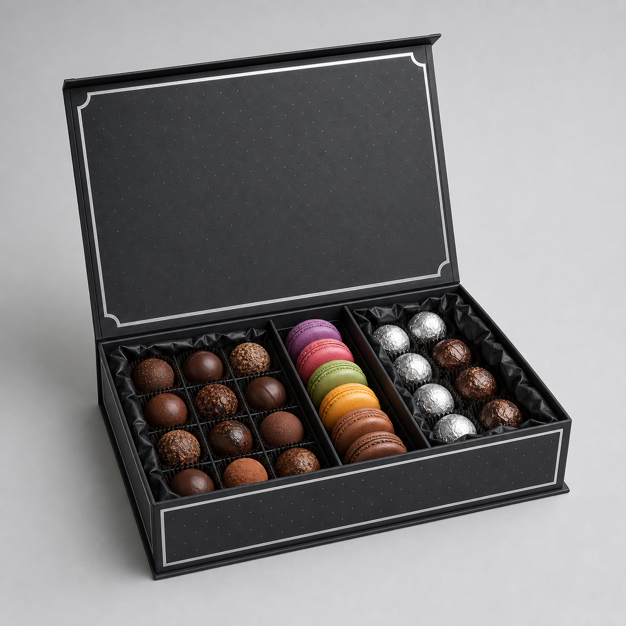Luxury black truffle and macaron box with silver foil details